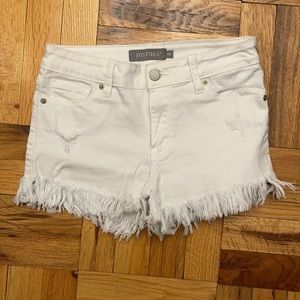 Fringe hem white jean shorts